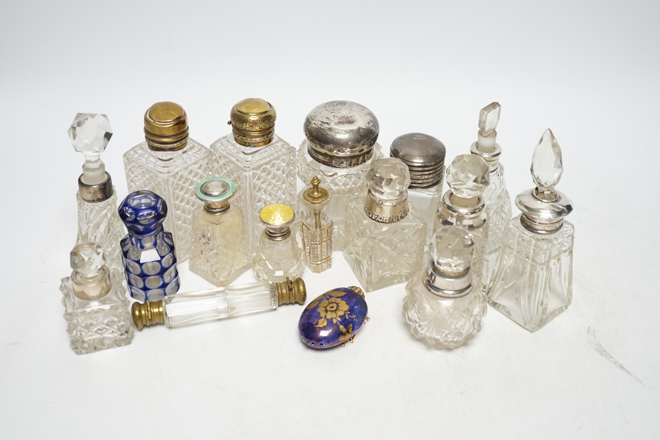 A collection of silver mounted and other perfume bottles